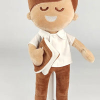 BibleBoy plush boy doll with buttoned up shirt and slacks holds his Bible .