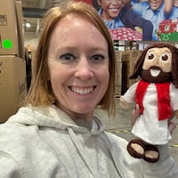 Workers at the Operation Christmas Child Processing Center in Boone, NC. are packing The Shoebox Jesus Doll into shoeboxes to be distributed to children around the world.