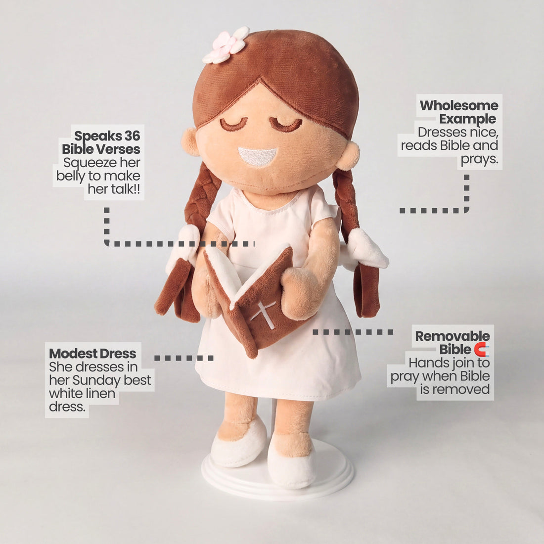 BibleGirl is the adorable plush girl doll that speaks 36 Bible verses.  Holds her Bible with magnets in her hands and in the Bible.  Wholesome dress.  Beautiful braids with bows and a flower in her hair.  Perfect baptism gift idea for Christian girls.  From Jesusdoll.com.